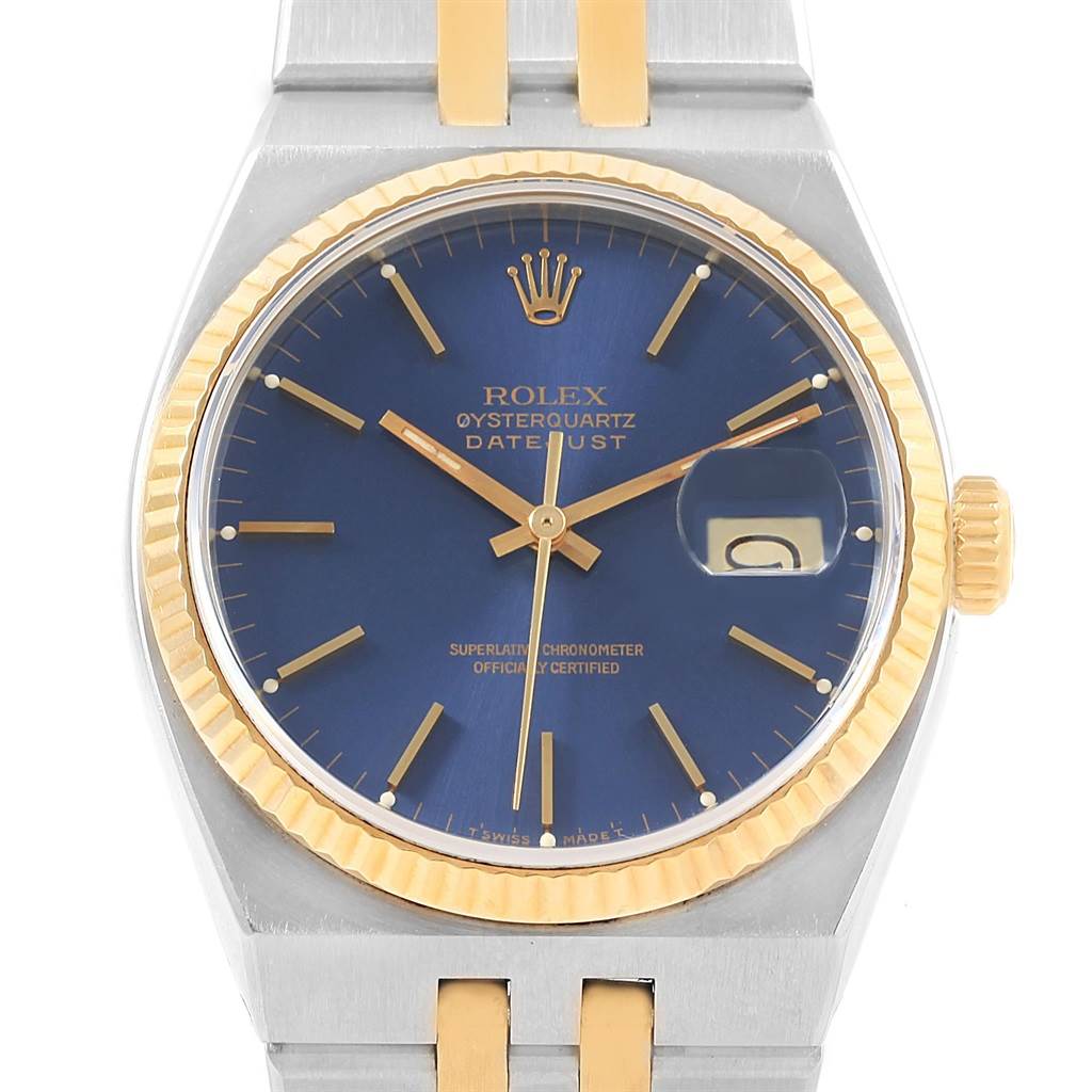 The image shows the face of a Rolex Oysterquartz 17013 Men's Stainless Steel Blue Dial 17013 Men's Stainless Steel Blue Dial Datejust watch with a blue dial and two-tone metal bracelet.