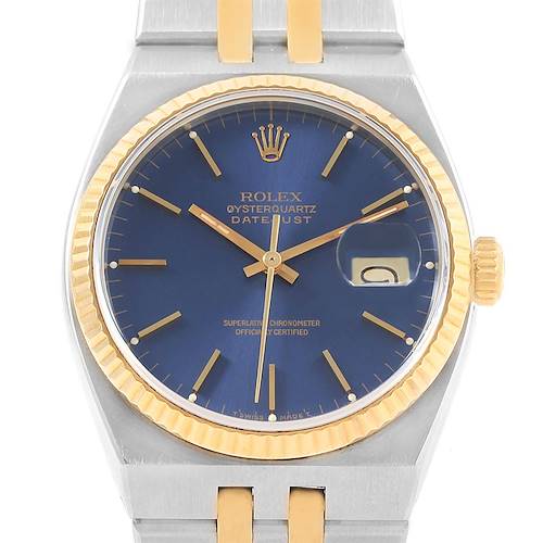 This image shows the face and part of the bracelet of a Rolex Oysterquartz 17013 Men's Stainless Steel Blue Dial 17013 Men's Stainless Steel Blue Dial Datejust, featuring a blue dial and gold accents.