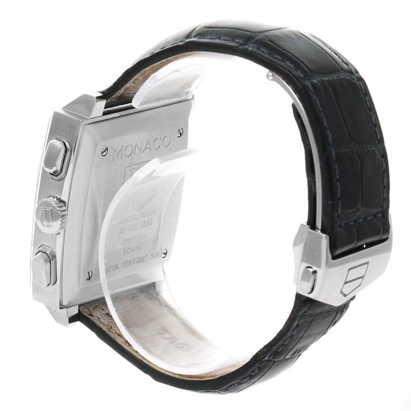The image shows the side and back of the Tag Heuer Monaco CW2113 Men's Stainless Steel Blue Dial CW2113 Men's Stainless Steel Blue Dial watch, focusing on its case, buttons, and leather strap.
