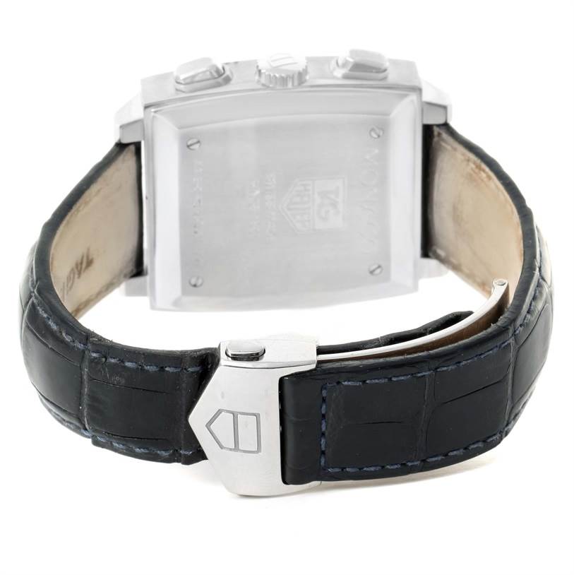 The image shows the back case and clasp of a Tag Heuer Monaco CW2113 Men's Stainless Steel Blue Dial CW2113 Men's Stainless Steel Blue Dial watch, featuring a black leather strap.