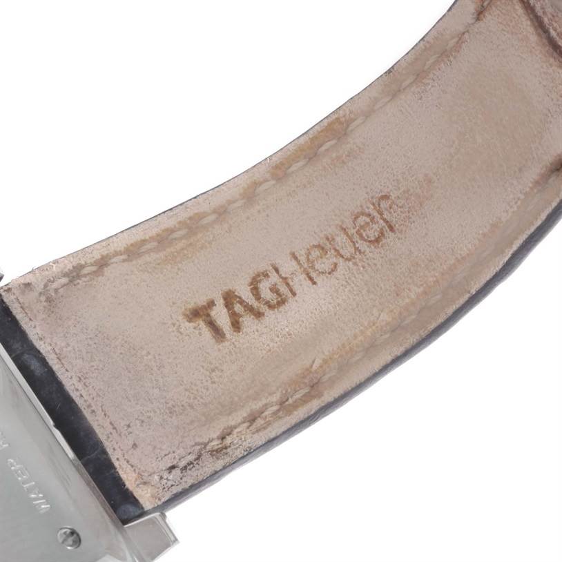 The image shows a close-up of the leather strap of a Tag Heuer Monaco CW2113 Men's Stainless Steel Blue Dial CW2113 Men's Stainless Steel Blue Dial watch, with the brand name visible on the inside.