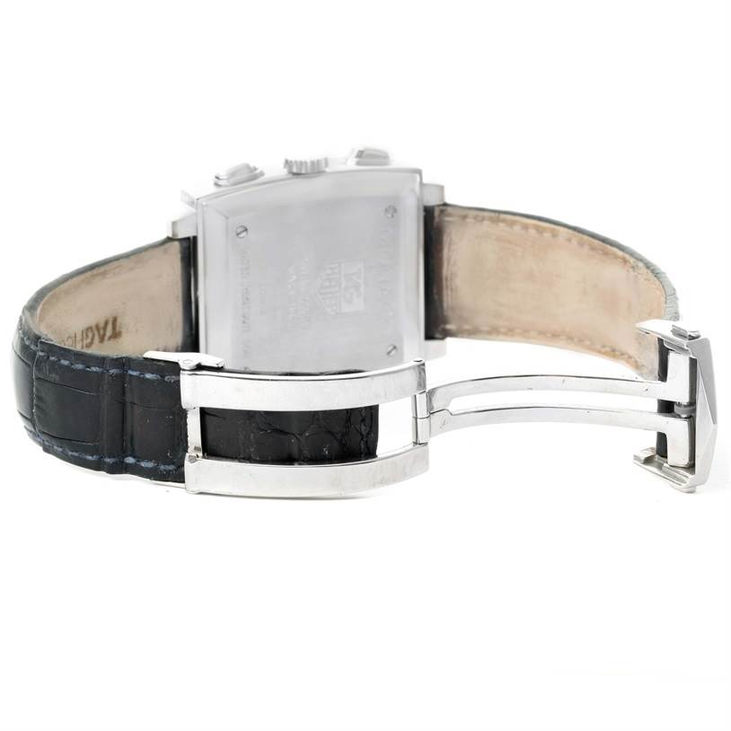 The image shows the back view of a Tag Heuer Monaco CW2113 Men's Stainless Steel Blue Dial CW2113 Men's Stainless Steel Blue Dial watch, including its leather strap and deployment clasp.