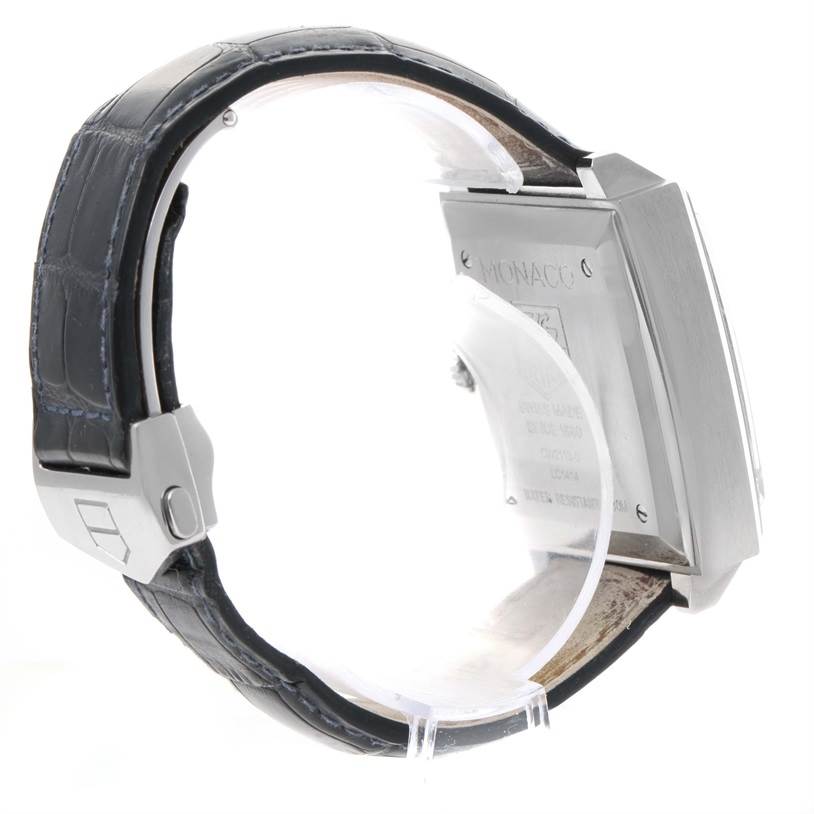 The image shows a side view of the Tag Heuer Monaco CW2113 Men's Stainless Steel Blue Dial CW2113 Men's Stainless Steel Blue Dial watch, highlighting its leather strap and stainless steel case back.
