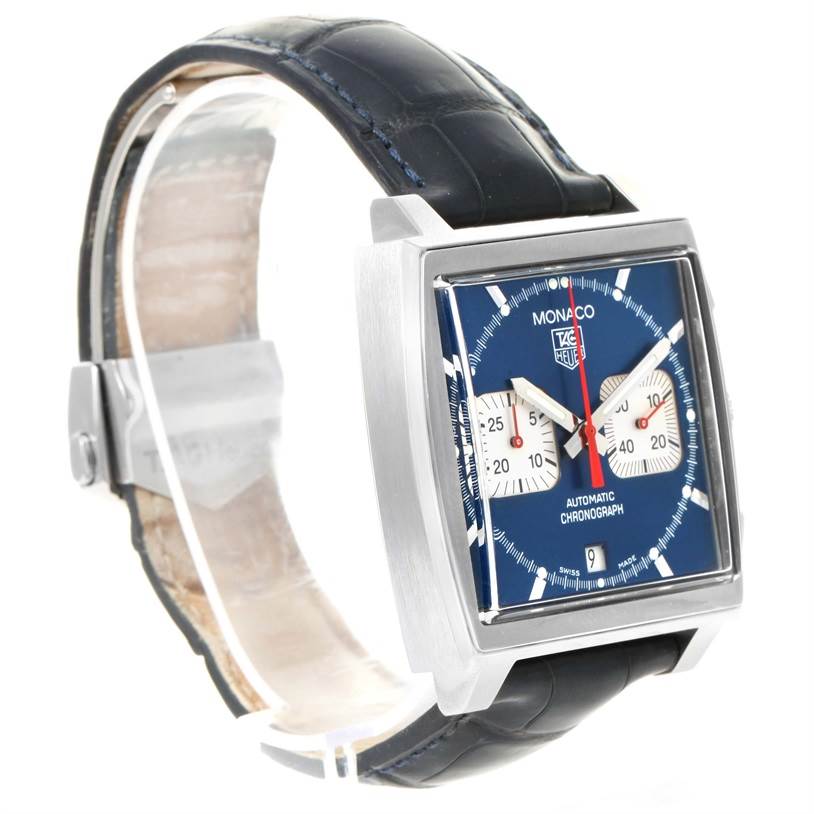 This image shows a Tag Heuer Monaco CW2113 Men's Stainless Steel Blue Dial CW2113 Men's Stainless Steel Blue Dial watch from an angled side view, highlighting its square dial, two subdials, and leather strap.