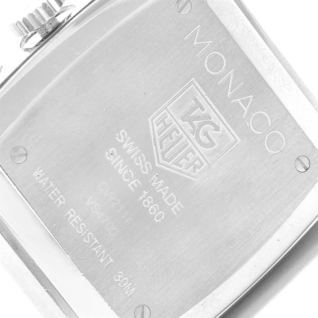 This image shows the back case of a Tag Heuer Monaco CW2114 Men's Stainless Steel Brown Dial CW2114 Men's Stainless Steel Brown Dial watch, highlighting the engraved details and screws.