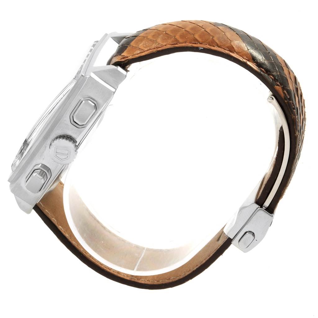 This image shows a side view of the Tag Heuer Monaco CW2114 Men's Stainless Steel Brown Dial CW2114 Men's Stainless Steel Brown Dial watch, highlighting the case, crown, and buttons along with the strap.