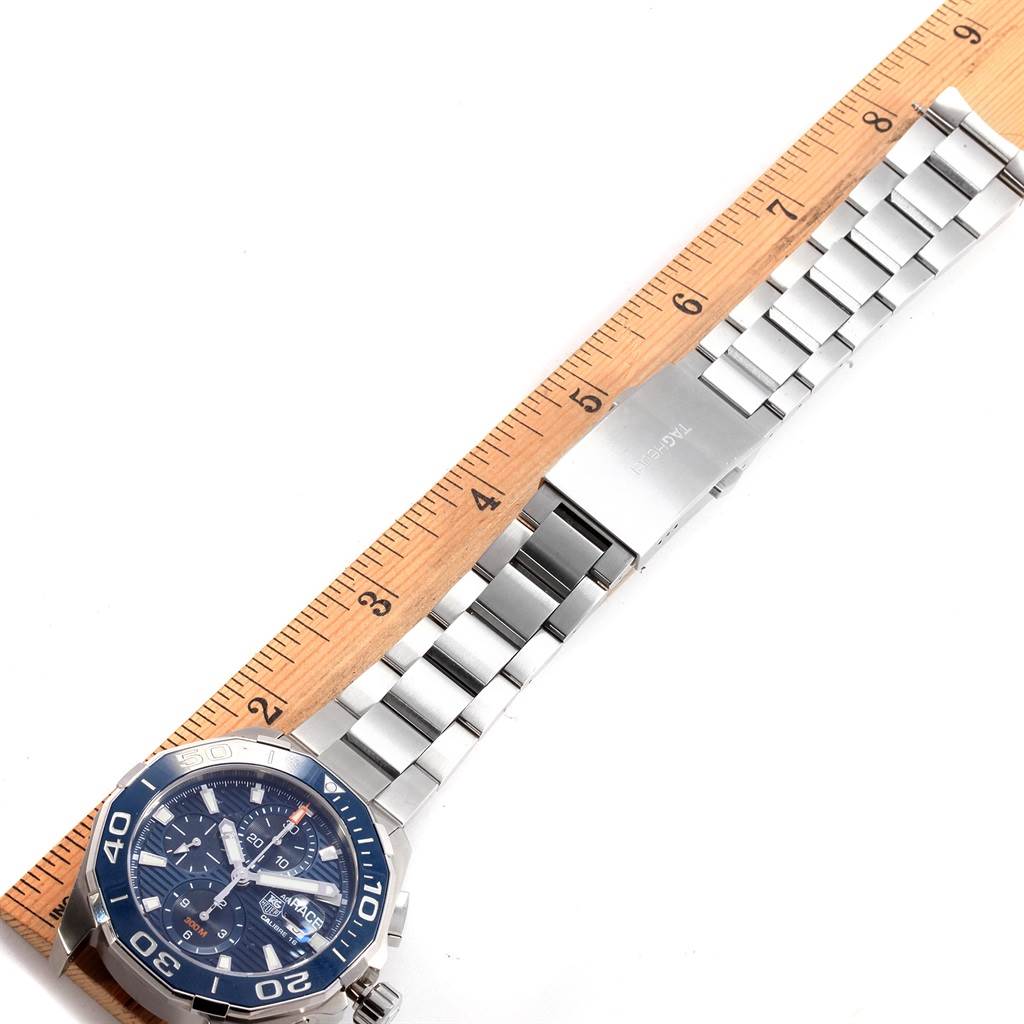 The image shows a top view of a Tag Heuer Aquaracer CAY211B.BA0927 Men's Stainless Steel Blue Dial CAY211B.BA0927 Men's Stainless Steel Blue Dial watch, highlighting the face, bezel, and metal bracelet.