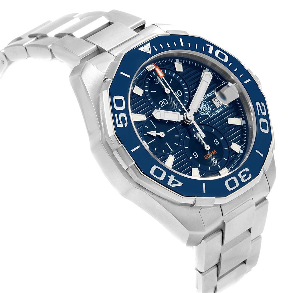 The image showcases a Tag Heuer Aquaracer CAY211B.BA0927 Men's Stainless Steel Blue Dial CAY211B.BA0927 Men's Stainless Steel Blue Dial watch at a three-quarter angle, highlighting its dial, bezel, and bracelet.