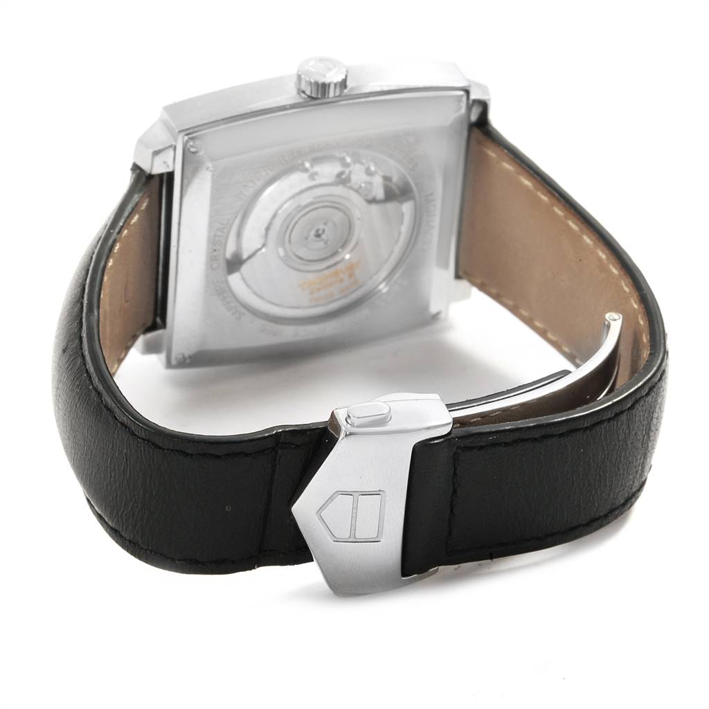 The image shows the back view of a Tag Heuer Monaco WW2111.FC6204 Men's Stainless Steel Blue Dial WW2111.FC6204 Men's Stainless Steel Blue Dial watch, highlighting the exhibition case back and clasp on the strap.