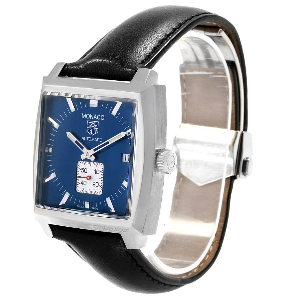 The image shows a side-front angle of the Tag Heuer Monaco WW2111.FC6204 Men's Stainless Steel Blue Dial WW2111.FC6204 Men's Stainless Steel Blue Dial watch, highlighting its square face, blue dial, and black leather strap.