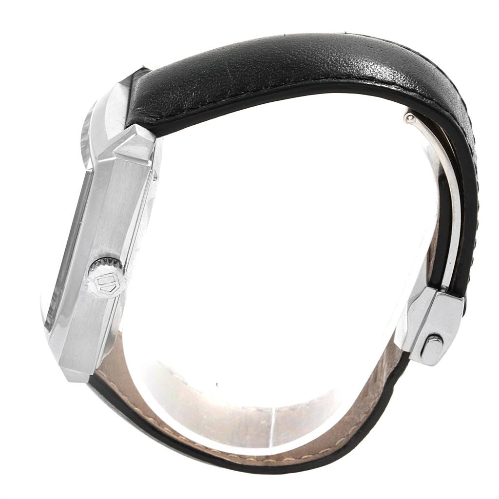 A Tag Heuer Monaco WW2111.FC6204 Men's Stainless Steel Blue Dial WW2111.FC6204 Men's Stainless Steel Blue Dial watch is displayed from a side angle, showing the crown, case, and leather strap.