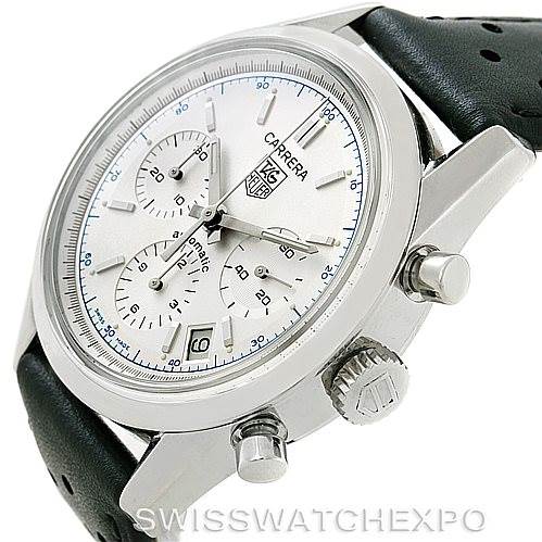 The image shows a side angle of a Tag Heuer Classic Carrera watch, highlighting the dial, crown, push buttons, and part of the leather strap.