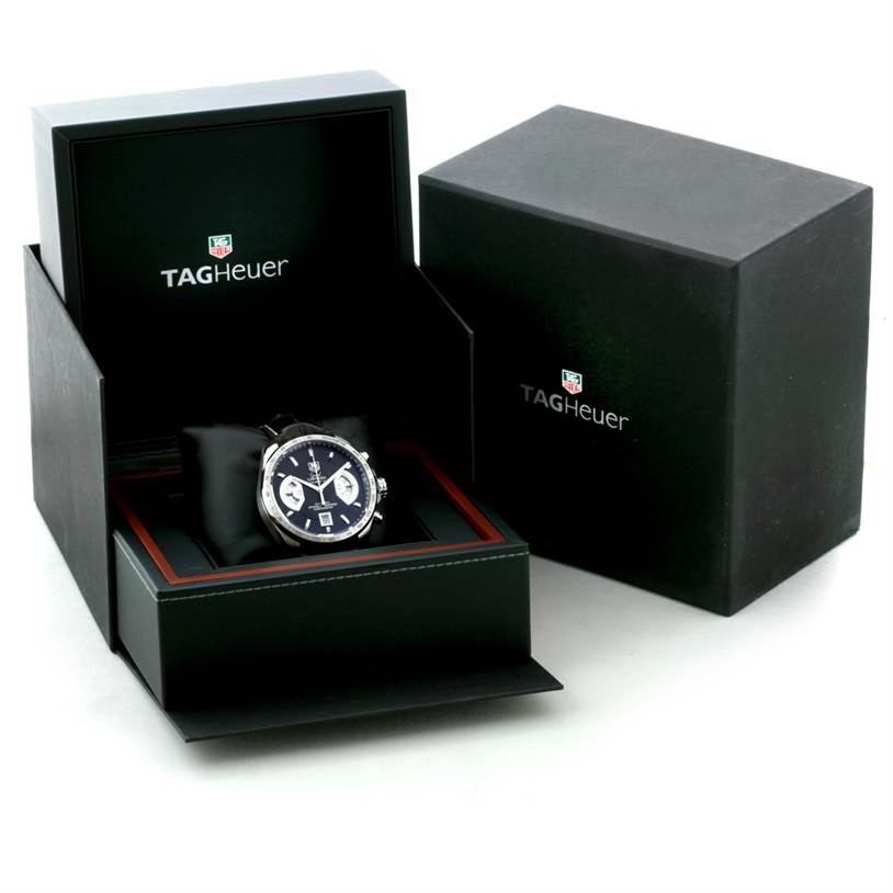 The Tag Heuer Carrera CAV511A.FC6225 Men's Stainless Steel Black Dial CAV511A.FC6225 Men's Stainless Steel Black Dial watch is shown at an angle inside its branded open black box with another closed box beside it.