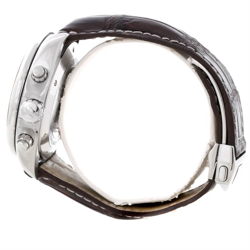 The image shows a side view of a Tag Heuer Carrera CAV511A.FC6225 Men's Stainless Steel Black Dial CAV511A.FC6225 Men's Stainless Steel Black Dial watch, highlighting its crown, pushers, and leather strap with a deployment clasp.