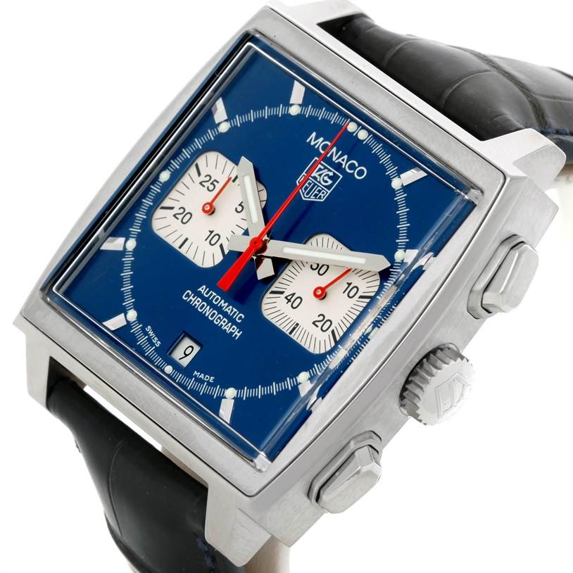 The image shows a Tag Heuer Monaco CW2113 Men's Stainless Steel Blue Dial CW2113 Men's Stainless Steel Blue Dial watch at an angled close-up, highlighting its face, crown, and leather strap.