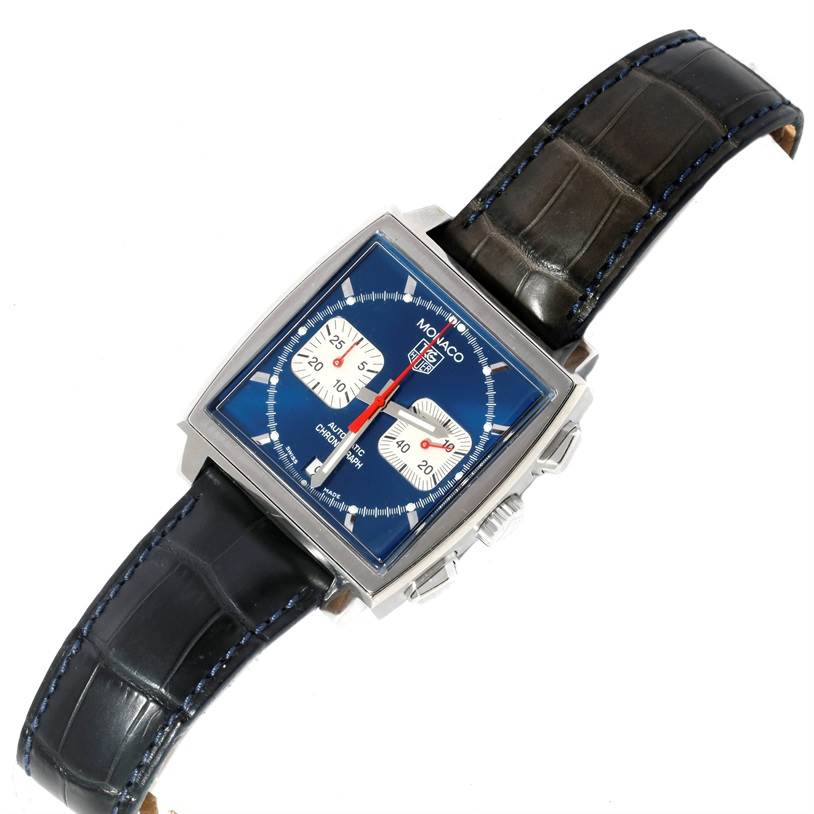 The image shows a top-down view of a Tag Heuer Monaco CW2113 Men's Stainless Steel Blue Dial CW2113 Men's Stainless Steel Blue Dial watch with a square blue dial and a black leather strap.