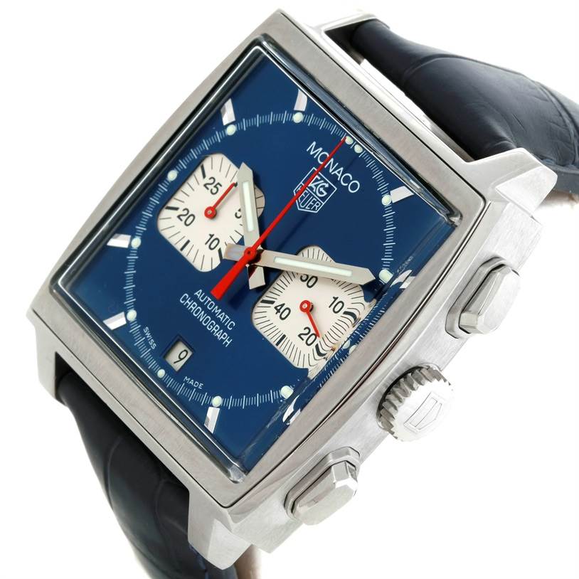 The image shows a Tag Heuer Monaco CW2113 Men's Stainless Steel Blue Dial CW2113 Men's Stainless Steel Blue Dial watch at an angled close-up, highlighting the blue dial, two sub-dials, and the crown.