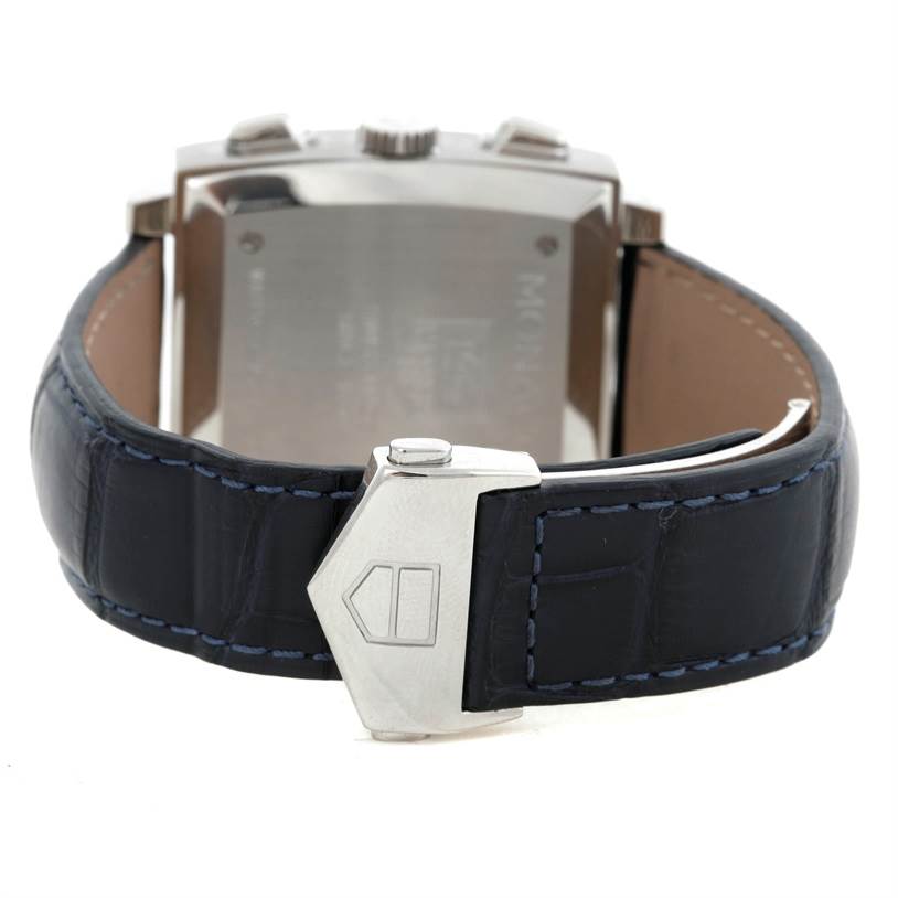 This image shows the back of the Tag Heuer Monaco CW2113 Men's Stainless Steel Blue Dial CW2113 Men's Stainless Steel Blue Dial watch and its leather strap with clasp.
