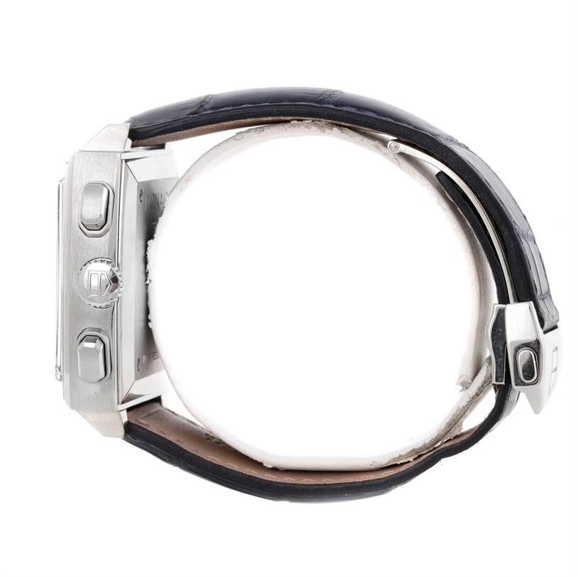 The image shows a side view of a Tag Heuer Monaco CW2113 Men's Stainless Steel Blue Dial CW2113 Men's Stainless Steel Blue Dial watch, highlighting the crown, pushers, and leather strap.