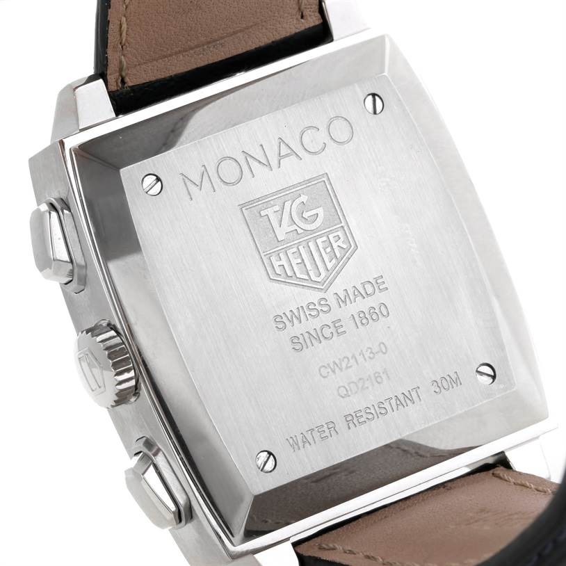 The image shows the back case of the Tag Heuer Monaco CW2113 Men's Stainless Steel Blue Dial CW2113 Men's Stainless Steel Blue Dial watch, showcasing its engravings and side buttons.