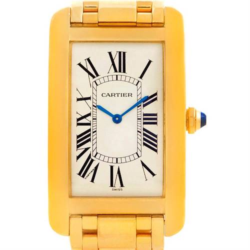 This image shows a front view of the Cartier Tank Americaine 1735 Men's Yellow Gold Silver Dial 1735 Men's Yellow Gold Silver Dial watch, displaying its face, gold case, and part of the bracelet.