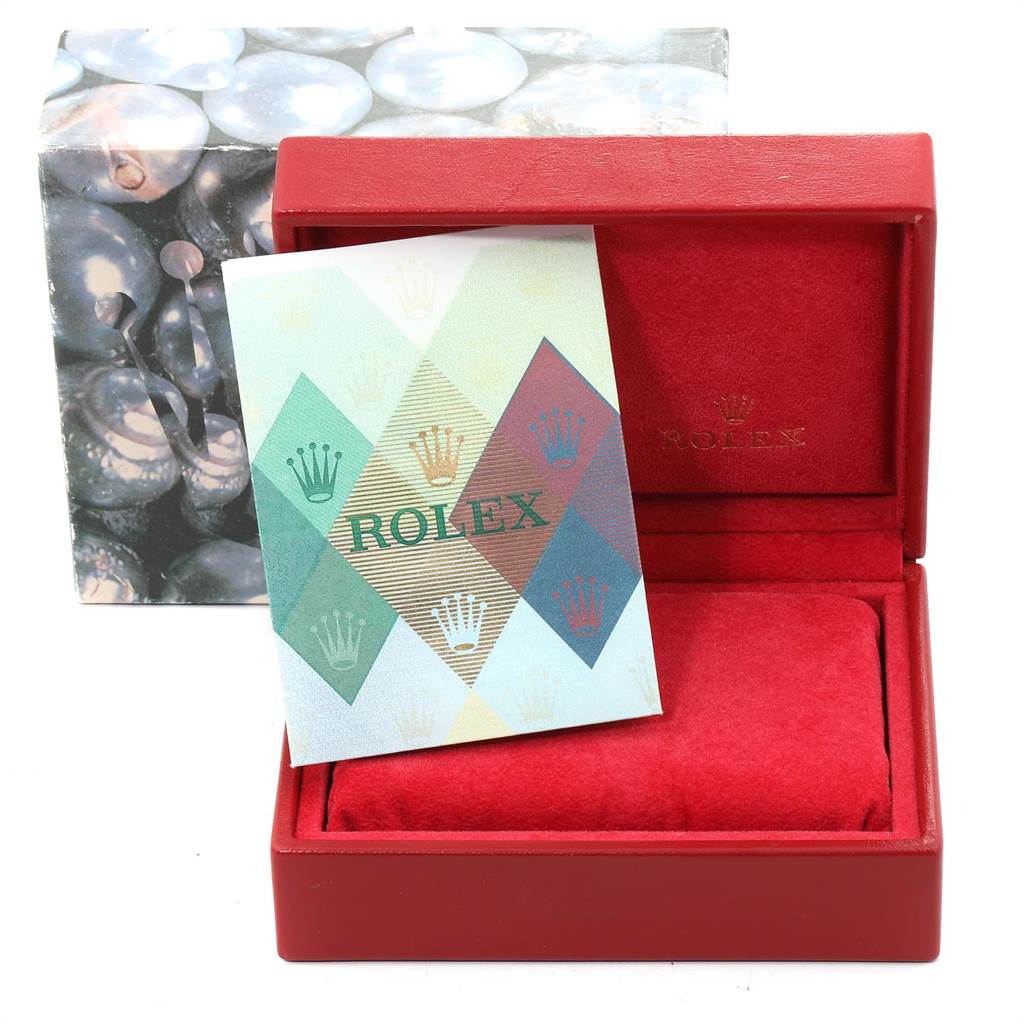 This image shows packaging for a Rolex Oyster Perpetual 76183 Women's Steel and Gold (two tone) Grey Dial 76183 Women's Steel and Gold (two tone) Grey Dial watch, including a red box and a branded booklet.