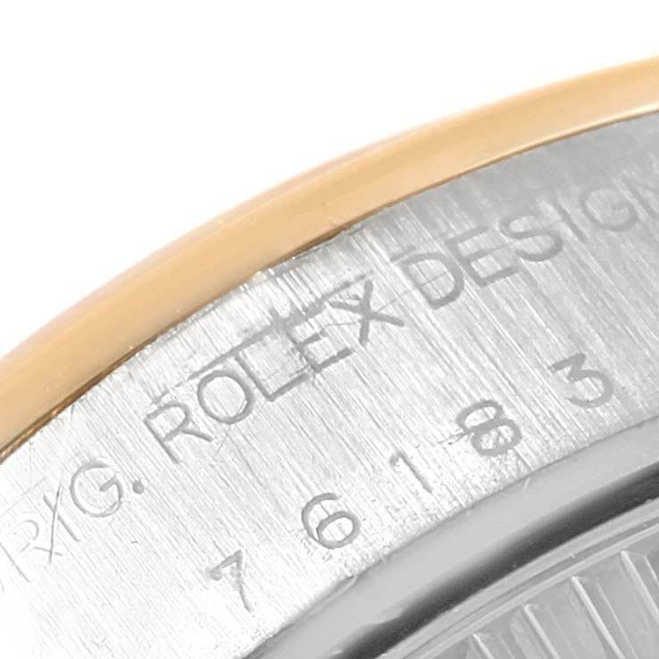This image shows a close-up of the side bezel engraving on a Rolex Oyster Perpetual 76183 Women's Steel and Gold (two tone) Grey Dial 76183 Women's Steel and Gold (two tone) Grey Dial watch.