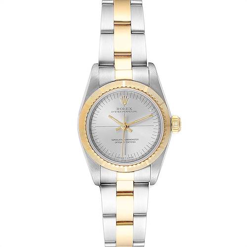 The Rolex Oyster Perpetual 76243 Women's Steel and Gold (two tone) Silver Dial 76243 Women's Steel and Gold (two tone) Silver Dial watch is shown from a front angle, displaying its dial, bezel, and two-tone bracelet.