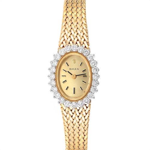 The image shows a front view of a Rolex Oyster Perpetual Women's Yellow Gold Champagne Dial Women's Yellow Gold Champagne Dial watch with a gold band and diamond-encrusted bezel.