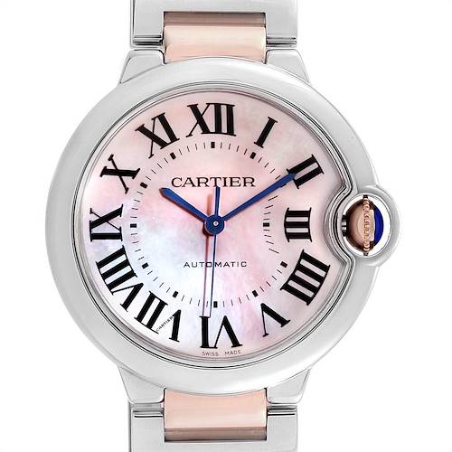 The image shows a front view of a Cartier Ballon Bleu W2BB0011 Women's Steel and Gold (two tone) Mother of Pearl Dial W2BB0011 Women's Steel and Gold (two tone) Mother of Pearl Dial watch, highlighting its face, Roman numerals, and a side crown with a blue gem.