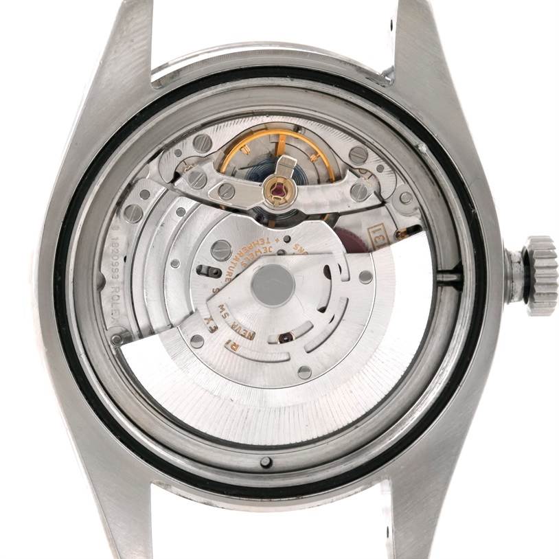 This image shows the back view of a Rolex Milgauss 116400 Men's Stainless Steel Black Dial 116400 Men's Stainless Steel Black Dial watch, highlighting its internal mechanical movement.