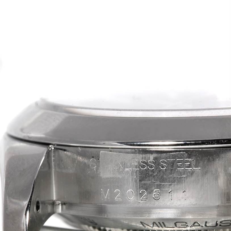 The image shows a close-up of the side of a Rolex Milgauss 116400 Men's Stainless Steel Black Dial 116400 Men's Stainless Steel Black Dial watch case with engraved serial numbers.