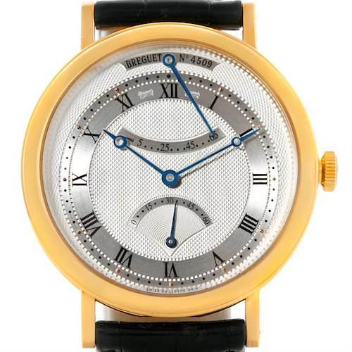 The image shows a front view of the Breguet Classique 5207BA/12/9V6 Men's Yellow Gold Silver Dial 5207BA/12/9V6 Men's Yellow Gold Silver Dial model watch, highlighting its Roman numerals, hands, and subdials.