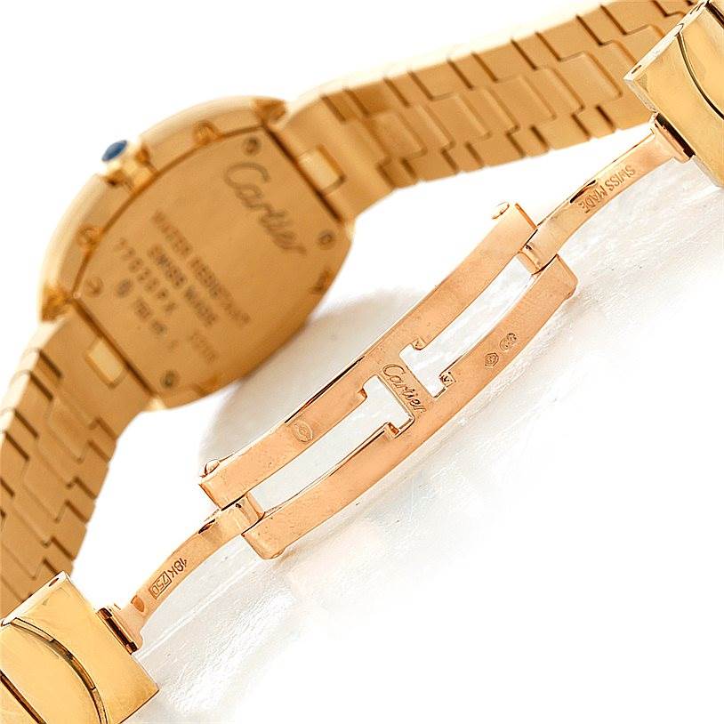 This image shows the clasp and backside of a Cartier Baignoire W8000008 Women's Yellow Gold Silver Dial W8000008 Women's Yellow Gold Silver Dial watch with the brand's engraving visible.