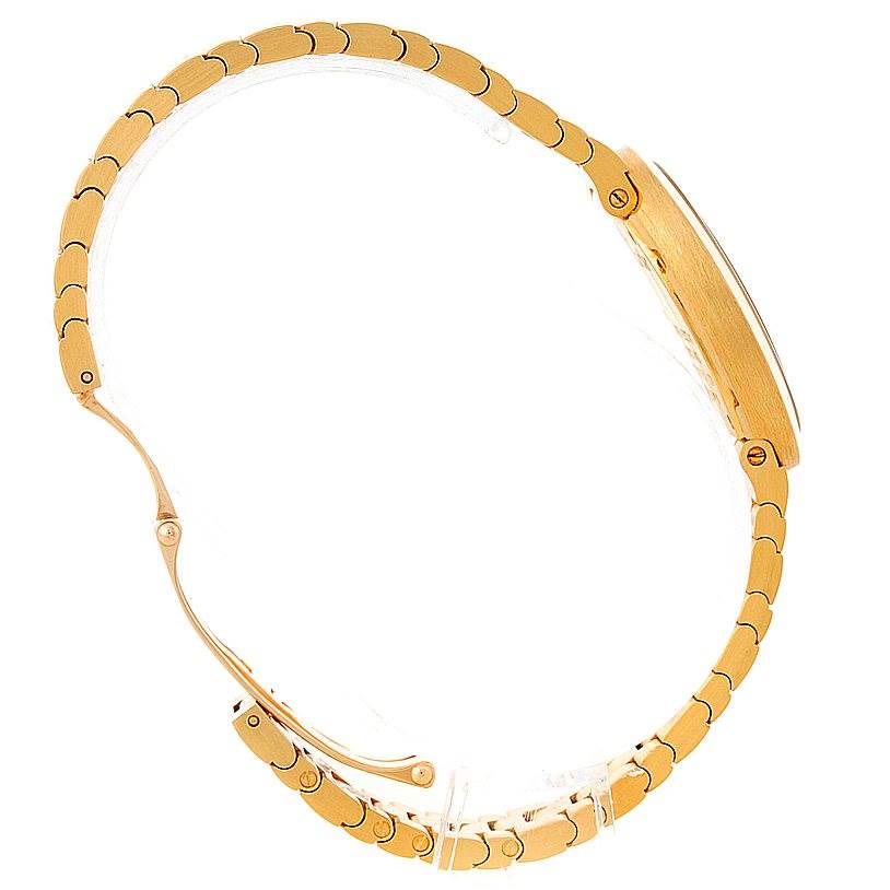 This image shows a side view of the gold bracelet and case of a Cartier Baignoire W8000008 Women's Yellow Gold Silver Dial W8000008 Women's Yellow Gold Silver Dial watch.