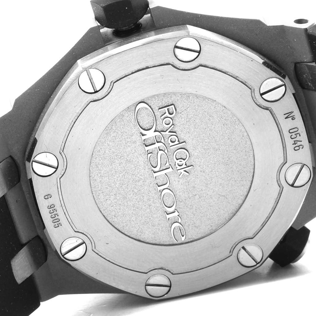 This image shows the back case of the Audemars Piguet Royal Oak Offshore 15703ST.OO.A002CA.01 Men's Stainless Steel Black Dial 15703ST.OO.A002CA.01 Men's Stainless Steel Black Dial watch, focusing on its engraved markings and screws.