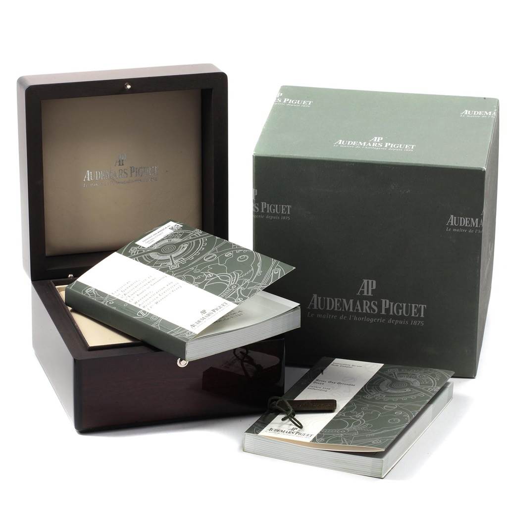 The image shows the packaging and accessories for an Audemars Piguet Royal Oak Offshore 15703ST.OO.A002CA.01 Men's Stainless Steel Black Dial 15703ST.OO.A002CA.01 Men's Stainless Steel Black Dial, including a box and manuals.