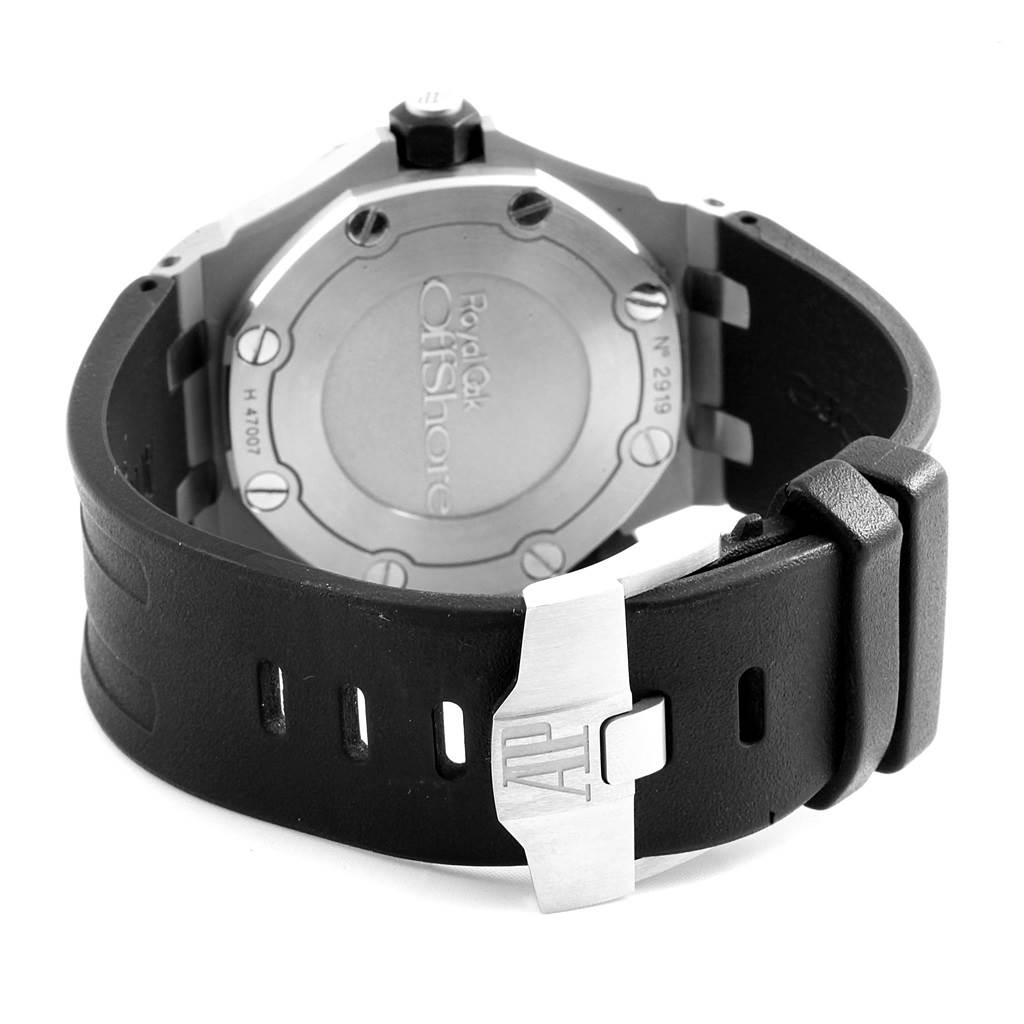 The image shows a rear angle of the Audemars Piguet Royal Oak Offshore 15703ST.OO.A002CA.01 Men's Stainless Steel Black Dial 15703ST.OO.A002CA.01 Men's Stainless Steel Black Dial watch, highlighting its case back and black rubber strap with a clasp.