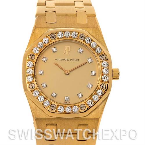 This image shows a front view of a gold Audemars Piguet Royal Oak Women's Yellow Gold Champagne Dial Women's Yellow Gold Champagne Dial watch with a diamond-studded bezel and bracelet.
