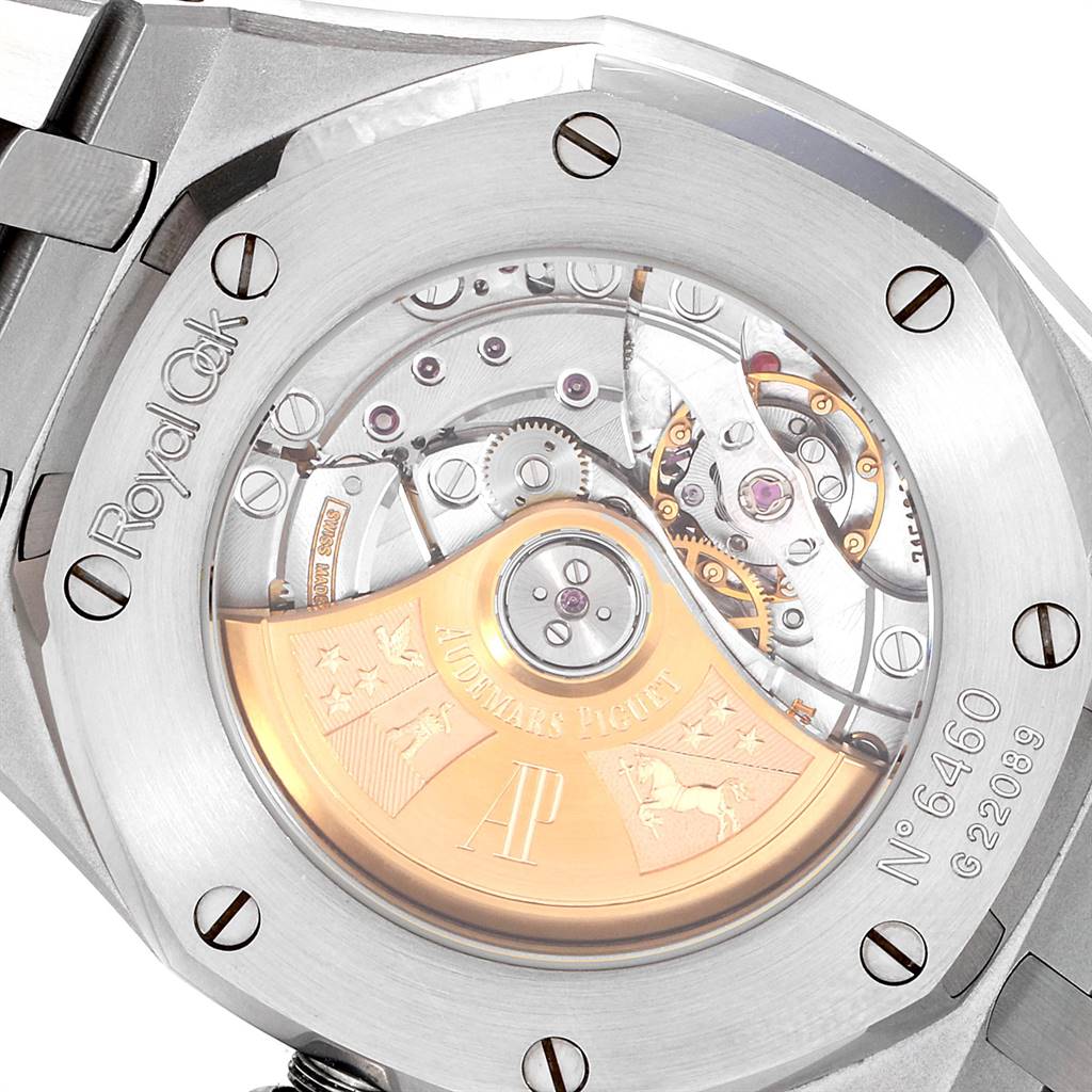 The image shows the back of a Royal Oak by Audemars Piguet, highlighting its exposed movement and engravings.