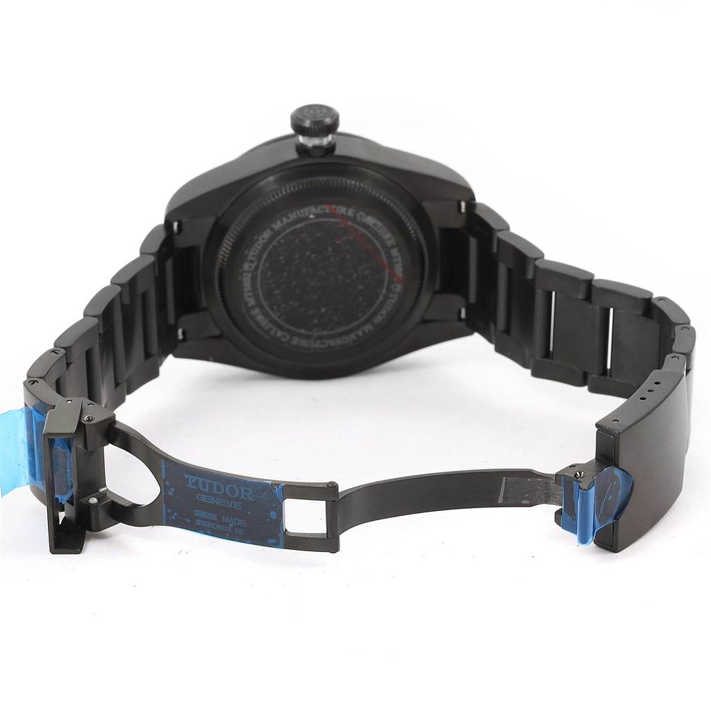 The Tudor Heritage Black Bay 79230DK Men's Stainless Steel Black Dial 79230DK Men's Stainless Steel Black Dial watch is shown from the back, highlighting the open clasp and the full length of the bracelet.