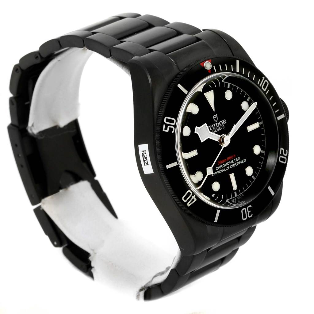 The image displays a side-angle view of a Tudor Heritage Black Bay 79230DK Men's Stainless Steel Black Dial 79230DK Men's Stainless Steel Black Dial watch, showing the watch face, bezel, and bracelet.