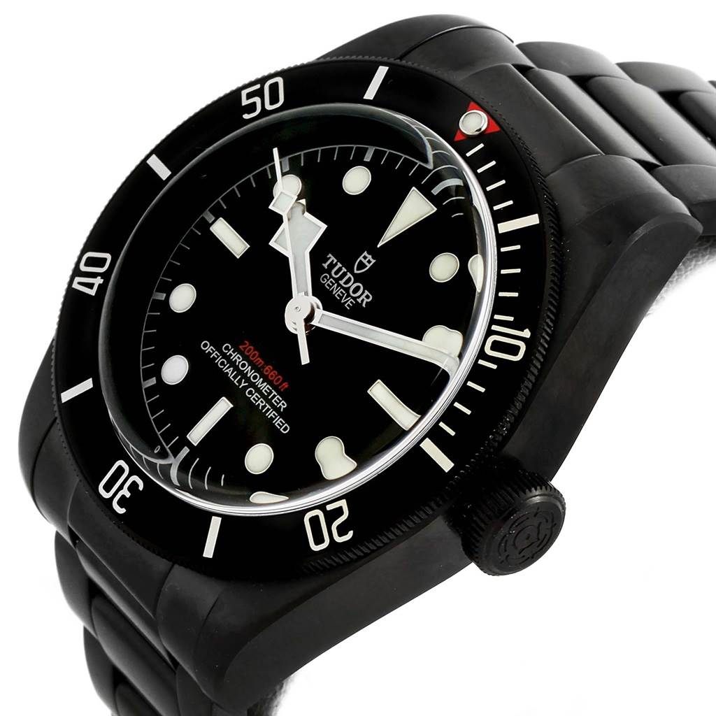 The Tudor Heritage Black Bay 79230DK Men's Stainless Steel Black Dial 79230DK Men's Stainless Steel Black Dial watch is shown at an angle highlighting the face, bezel, and part of the bracelet.