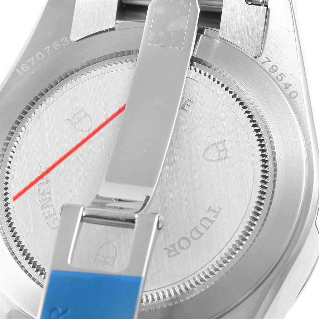 This image shows the backside of the Tudor Heritage Black Bay 79540 Men's Stainless Steel Black Dial 79540 Men's Stainless Steel Black Dial watch with its clasp and caseback visible.