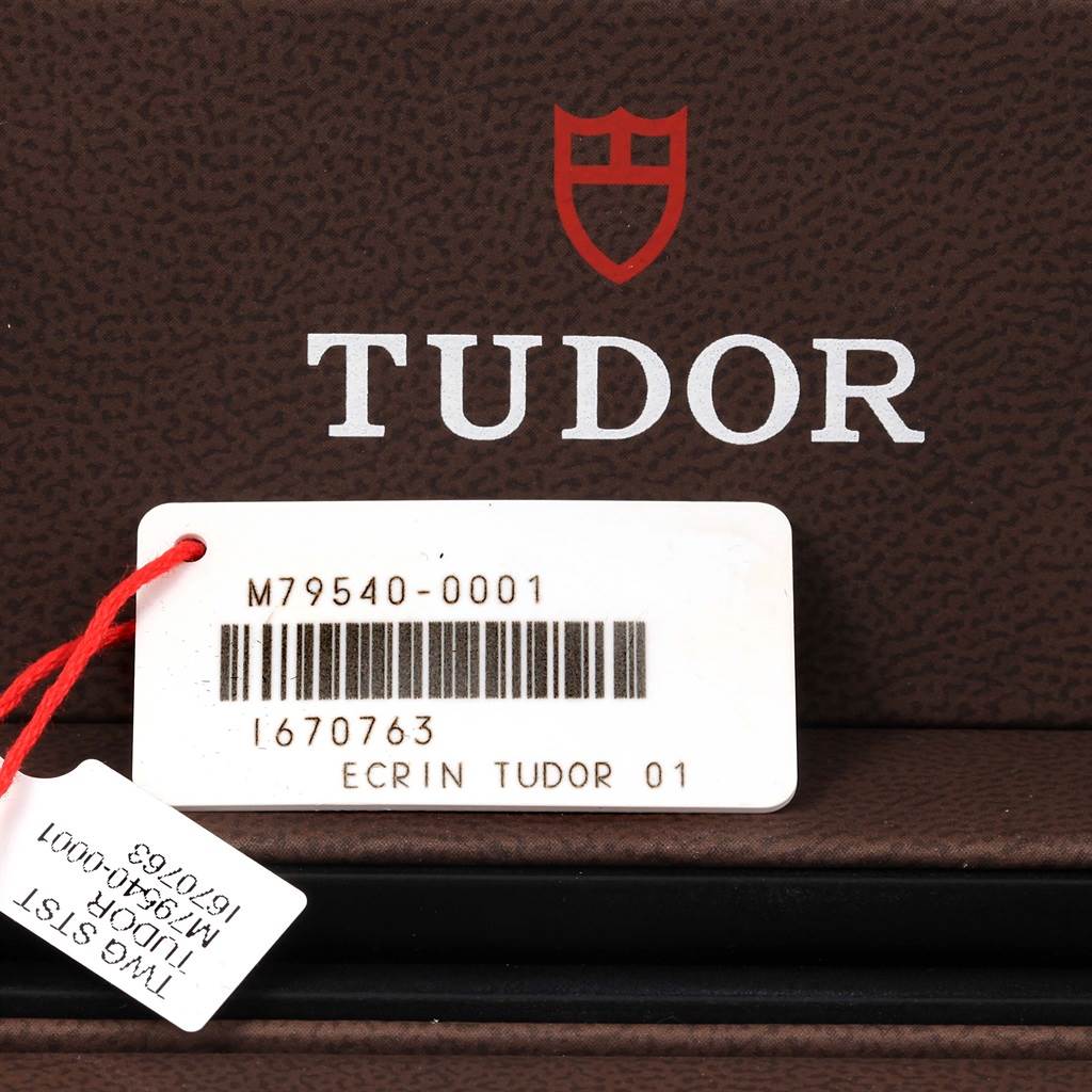 This image shows the packaging and labels of a Tudor Heritage Black Bay 79540 Men's Stainless Steel Black Dial 79540 Men's Stainless Steel Black Dial watch, including the model number M79540-0001.