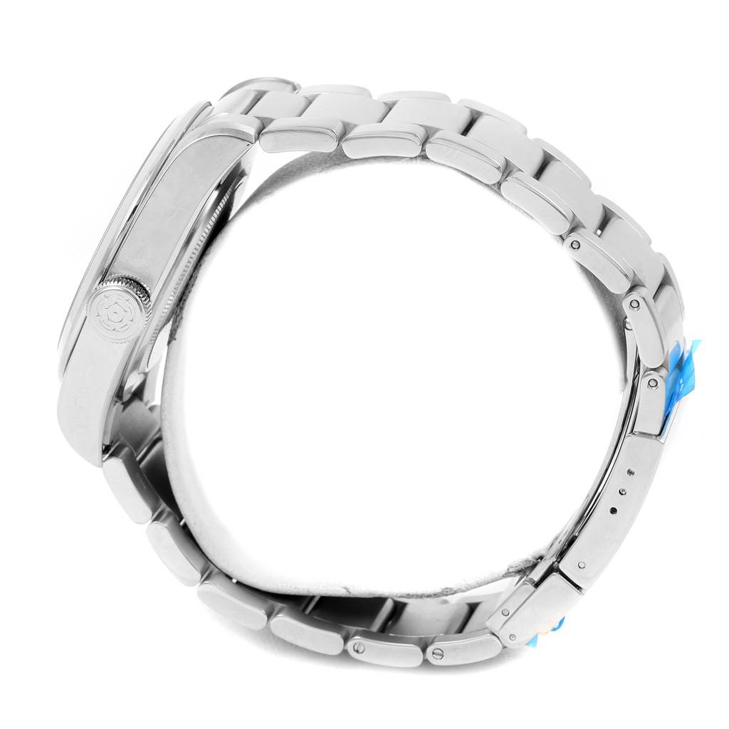 This side-angle view of the Tudor Heritage Black Bay 79540 Men's Stainless Steel Black Dial 79540 Men's Stainless Steel Black Dial watch shows the steel case, crown, and bracelet.