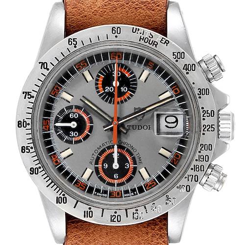 This image shows a close-up of the face of a Tudor Big Block 94300 Men's Stainless Steel Grey Dial 94300 Men's Stainless Steel Grey Dial watch, including its brown leather strap, dials, and date window.