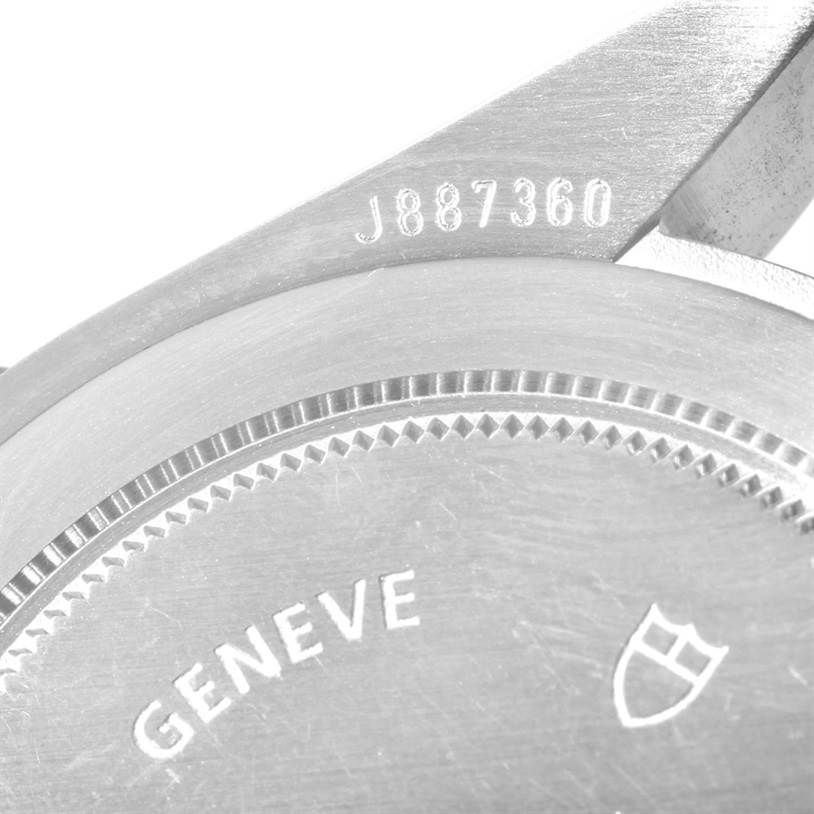 The image shows a close-up of the back casing of a Tudor Heritage Black Bay 79220 Men's Stainless Steel Black Dial 79220 Men's Stainless Steel Black Dial watch, revealing part of the serial number and "GENEVE" engraving.