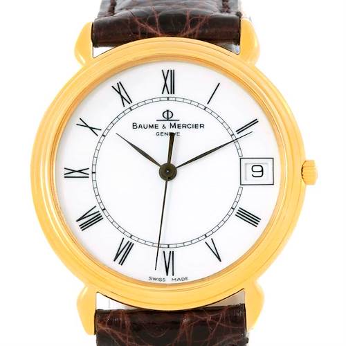The image shows a front view of the Baume & Mercier Classima 15163 Men's Yellow Gold White Dial 15163 Men's Yellow Gold White Dial watch, highlighting its face, Roman numerals, and leather strap.