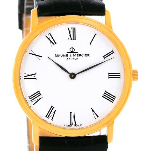 This image shows the dial, crown, and strap of a Baume & Mercier Classima MV045094 Men's Yellow Gold White Dial MV045094 Men's Yellow Gold White Dial watch from a front angle.